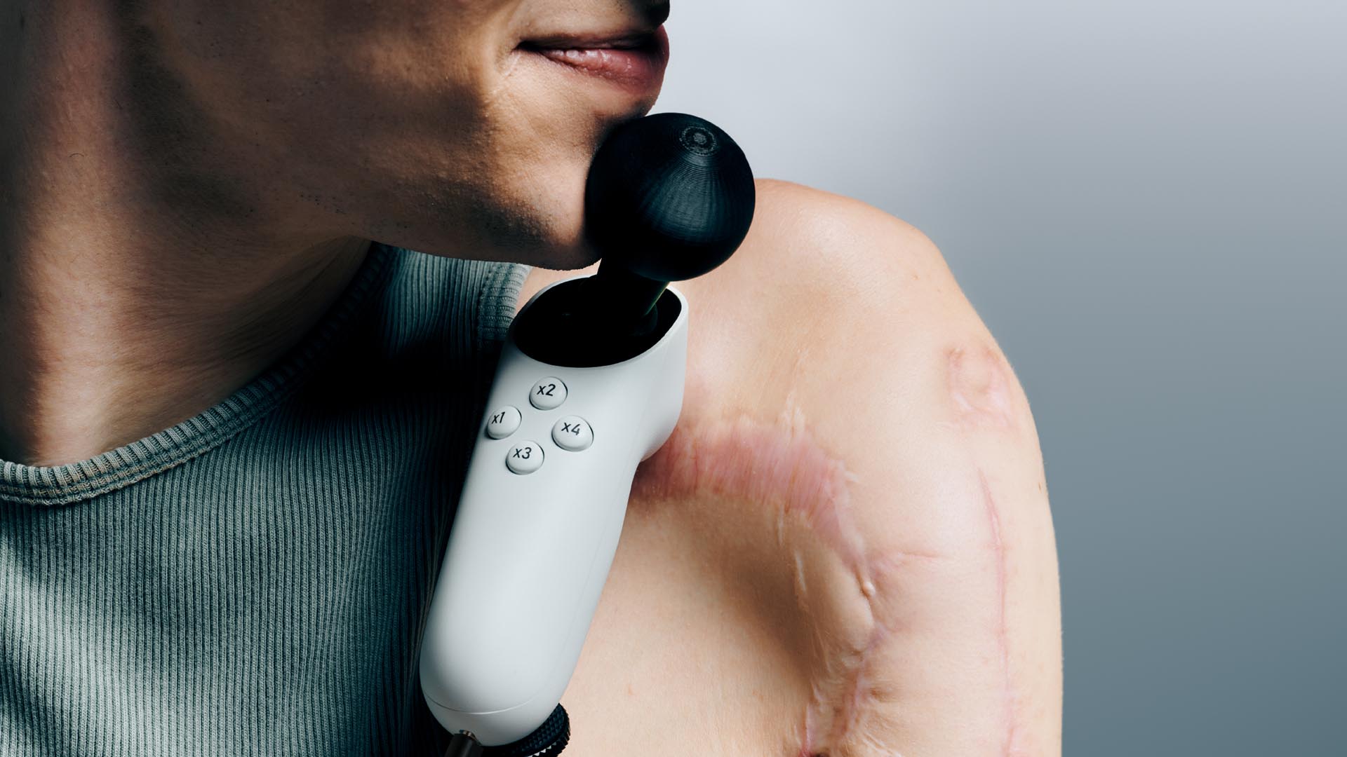 A player using the Xbox Adaptive Joystick with a chin-operated thumbstick topper